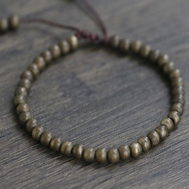 Red string copper bead bracelet showing spiritual abundance meaning concept