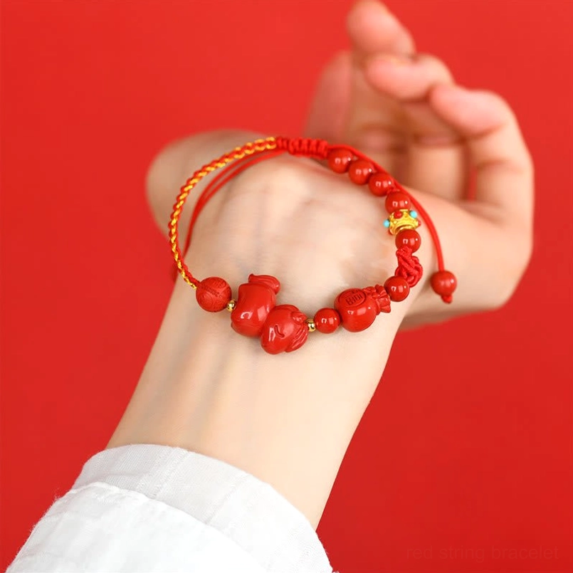 Cinnabar lucky red string bracelet worn on wrist side view