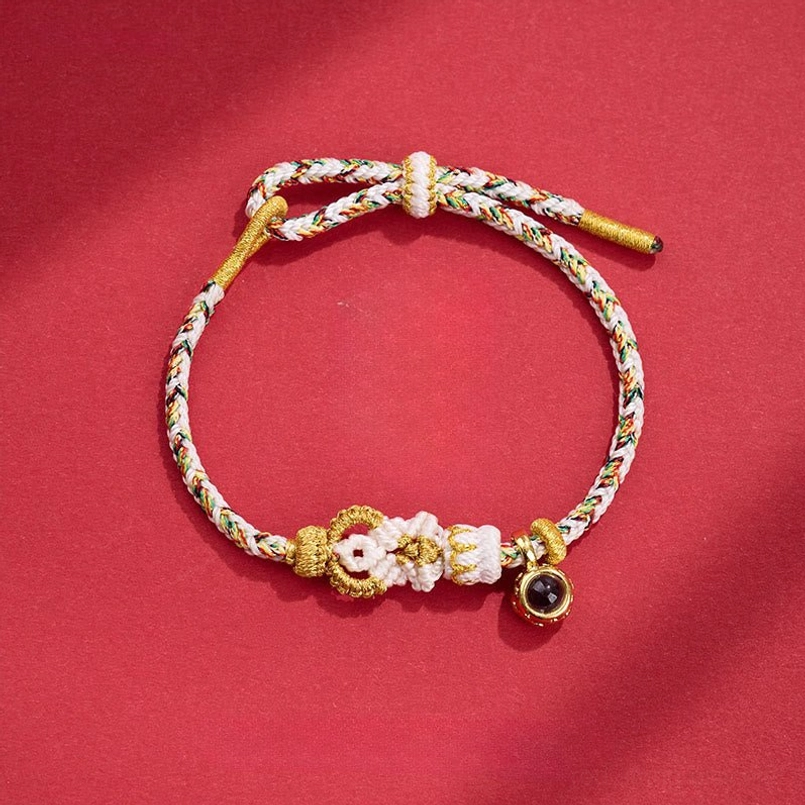White gold braided Buddha knot red string bracelet with white buddha knot design