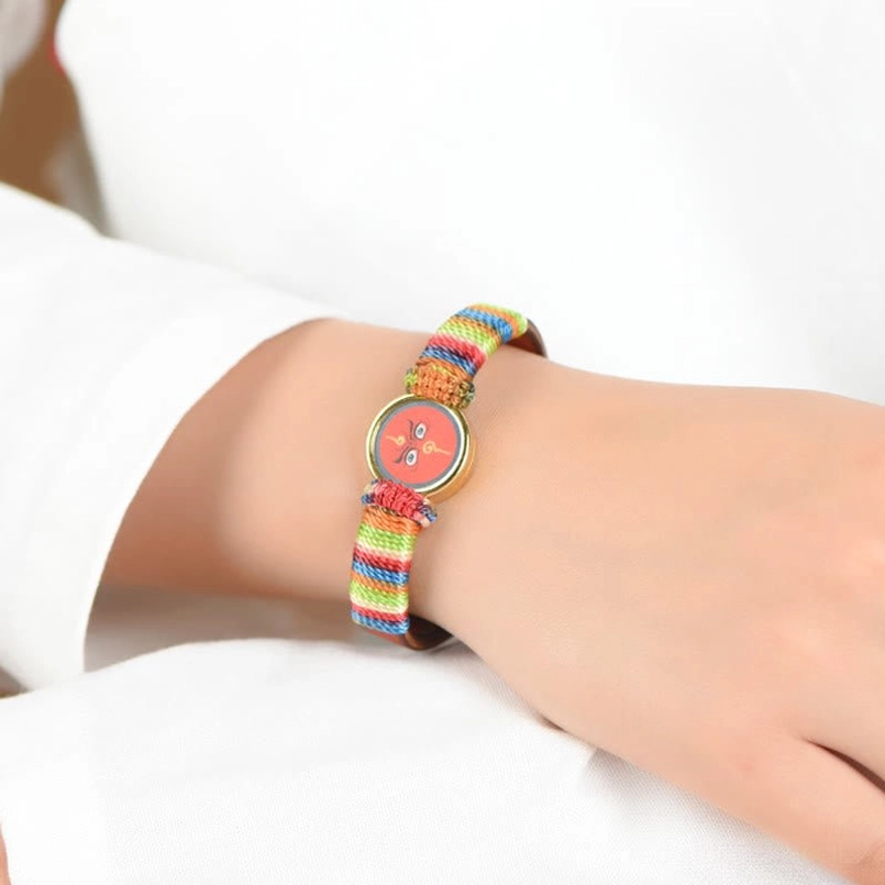 White Jambhala Buddha eye blessing bracelet with colorful braid and gold bezel