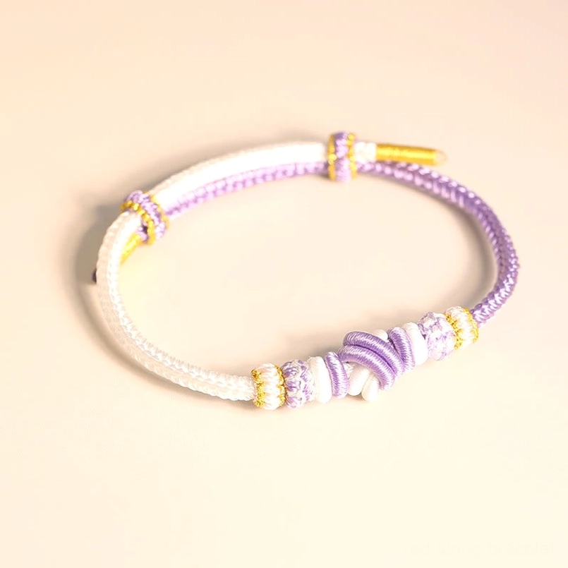 White and purple handcrafted eight thread peace knot bracelet with spiritual symbolism adjustable fit