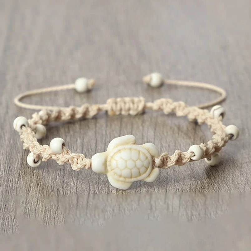 White turtle braided rope bracelet with sliding knot closure detail