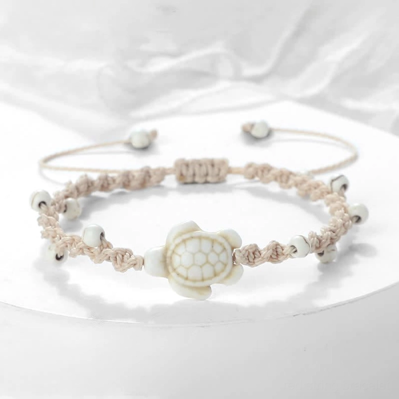 White turtle woven rope bracelet with off-white beads display
