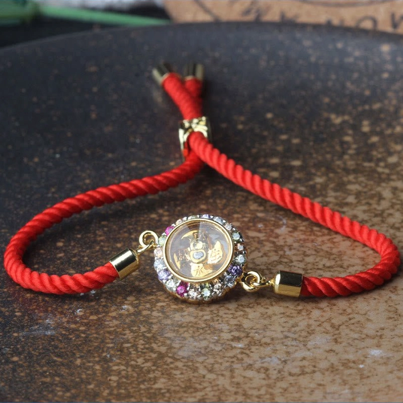 Rotatable windmill red string bracelet with colorful crystal border charm detail