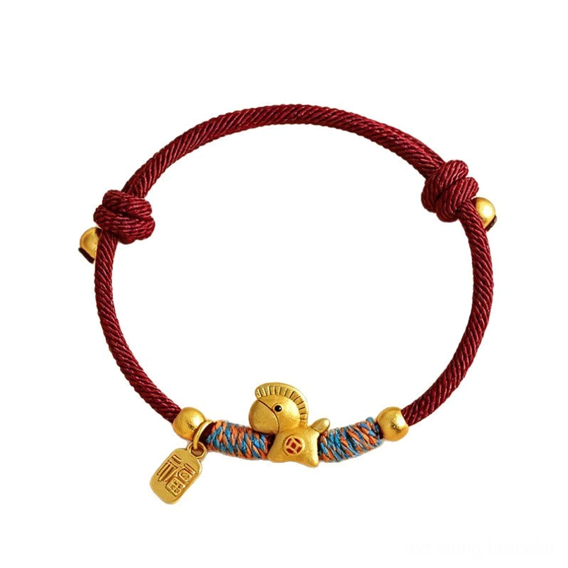wine red braided zodiac horse red string bracelet with gold beads on plain white background