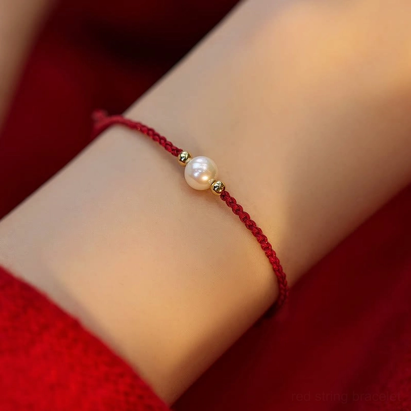 Wine red pearl string bracelet single pearl gold spacer beads woven cord close-up
