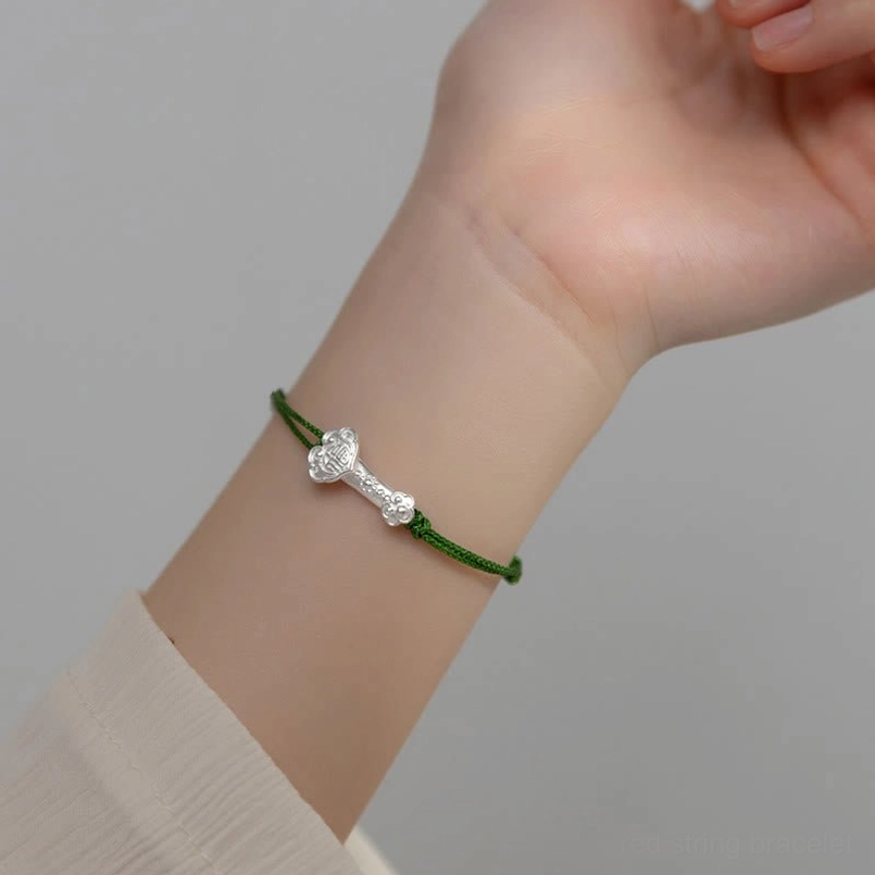 Real wrist wear shot of slim 999 silver ruyi luck green string bracelet for daily use