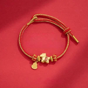 Year of the Horse red string copper braided bracelet with horse charm and gourd pendant on red background