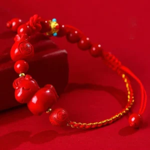 Year of the Horse Cinnabar Fu Character Lucky Red String Bracelet on red background