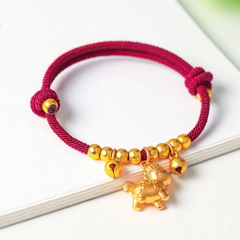 Red string zodiac horse lucky bracelet with gold horned horse charm bells adjustable fit
