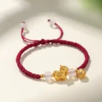 Year of the Horse red string bracelet with white agate flat lay view