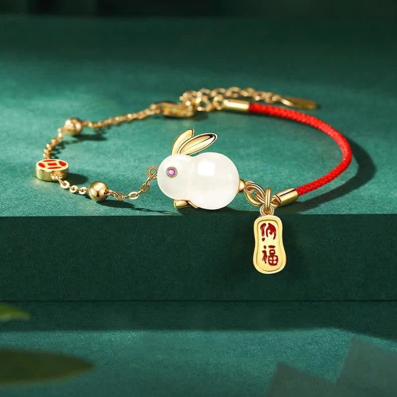 Year of the Rabbit White Jade Red String Bracelet main view on dark green background