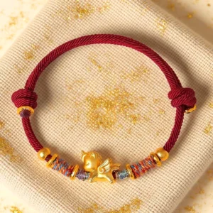 Year of the Horse 999 silver gold plated red string bracelet top flat lay