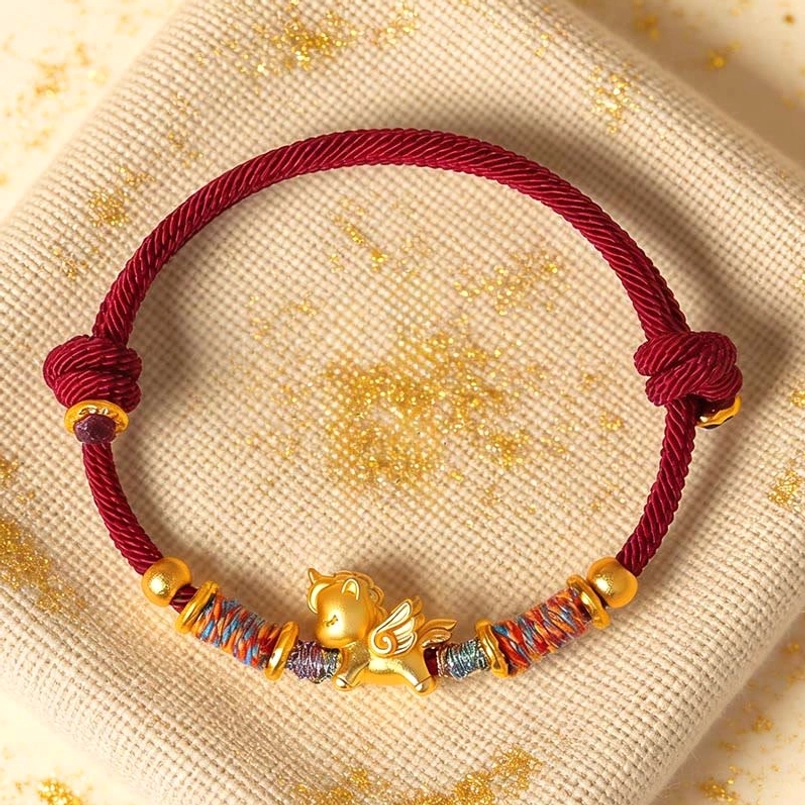 Year of the Horse 999 silver gold plated red string bracelet top flat lay