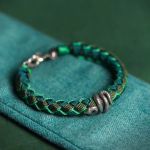 2025 Year of the Snake 999 Sterling Silver Green Black Braided Bracelet Flat Lay