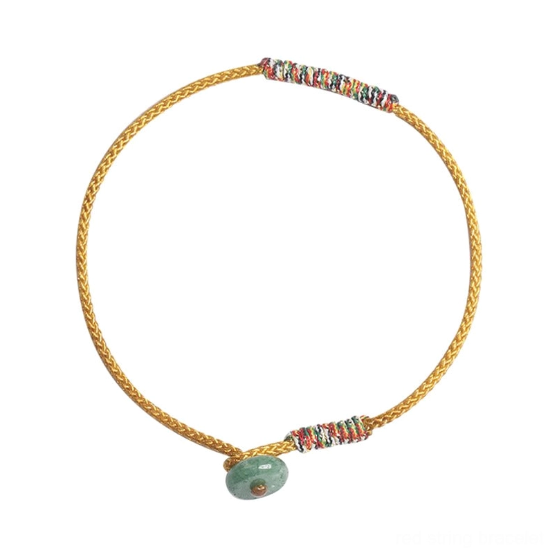 Yellow Tibetan braided lucky bracelet with double beaded wraps and green aventurine charm pendant