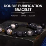 Yin Yang black obsidian lava rock red string bracelet high side view on dark metal display stand blue background