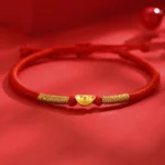 Red string braided luck bracelet with gold yuanbao ingot charm and adjustable knots