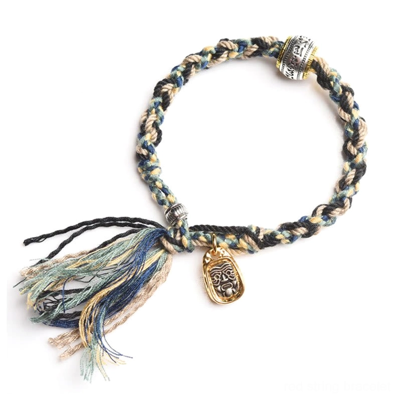 Sacred Zakiram protection bracelet front view with dark blue black braided cord and tassels
