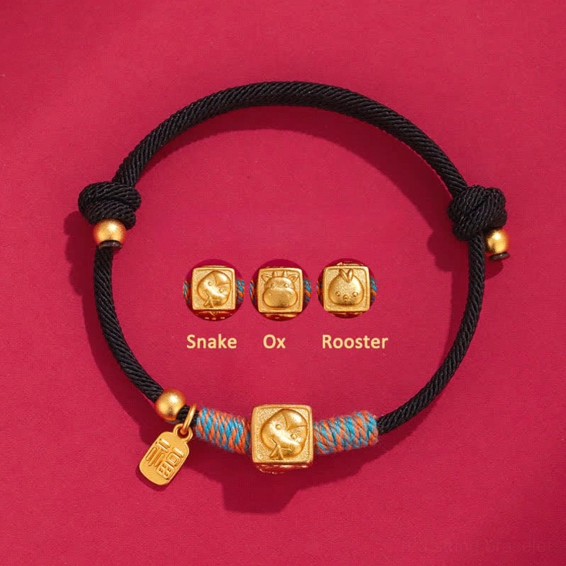 Snake Ox Rooster black string protection bracelet with gold metal charms and woven detail