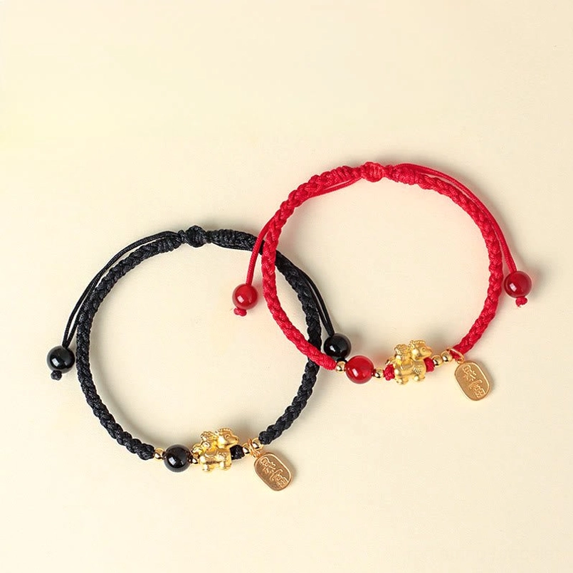 Year of the horse red string bracelet lucky charm detail close up