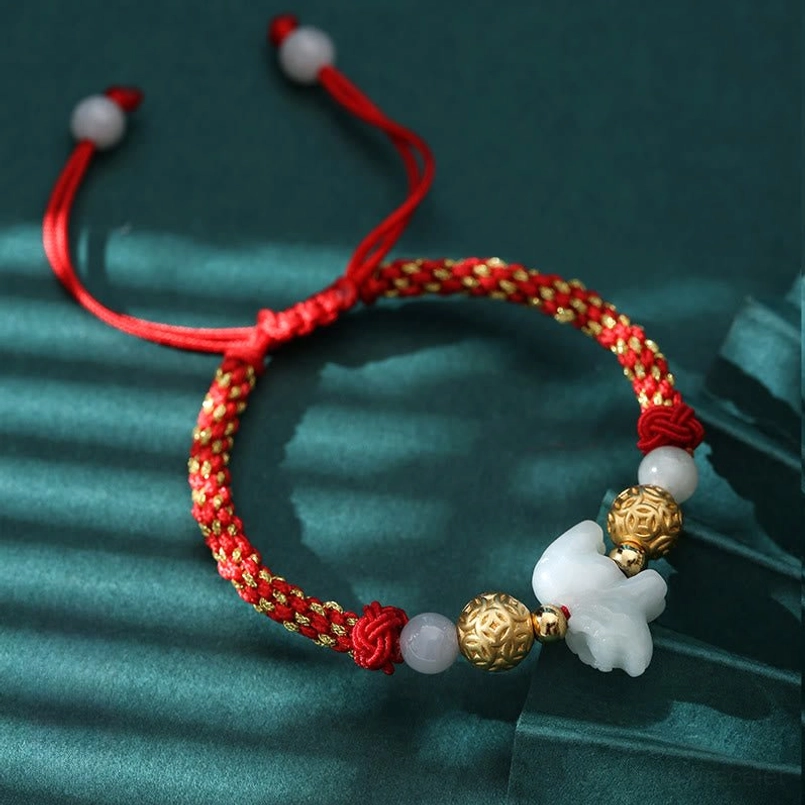 Chinese zodiac horse jade charm red string bracelet detail close-up