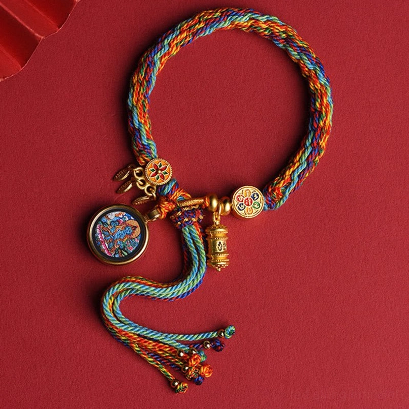 Horse zodiac natal Buddha red string bracelet showing detailed thangka charm and woven design
