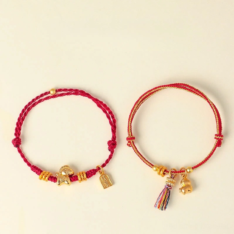Zodiac horse red string bracelet tassel end close up