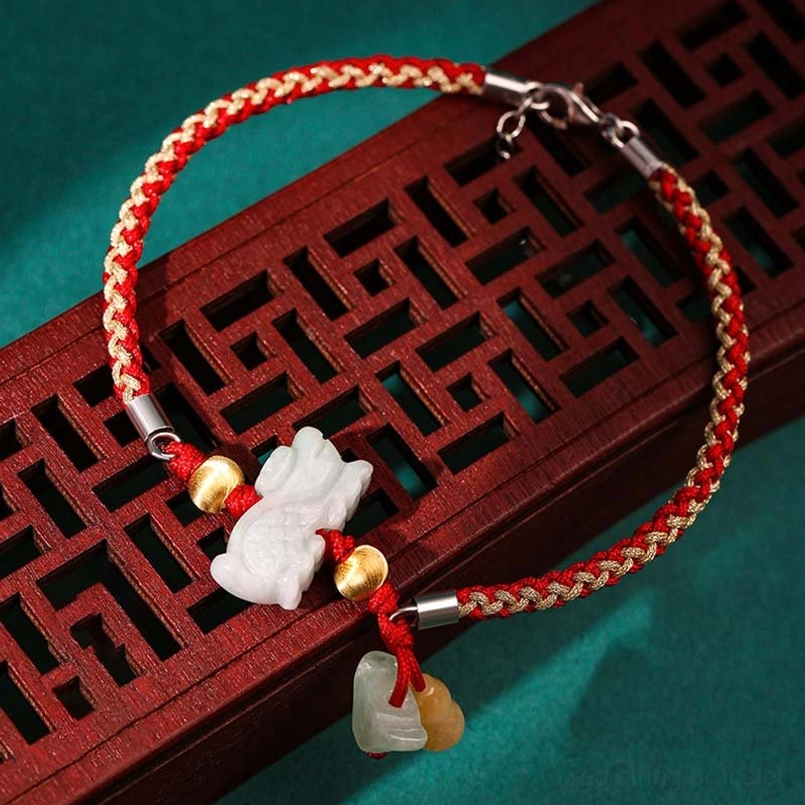 Zodiac red string bracelet with white jade charm and yellow jade pendant detail