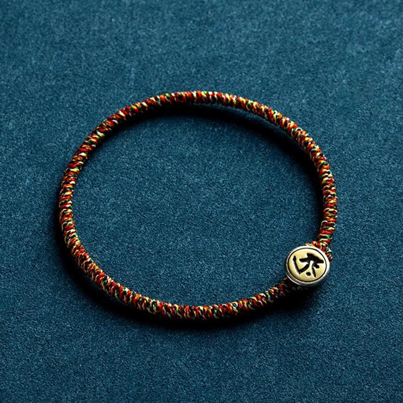 Single Chinese zodiac natal Buddha bracelet with tightly woven multicolor rope and engraved silver charm