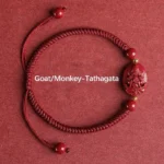 Goat Monkey zodiac Tathagata Buddha cinnabar red string bracelet flat lay gold accents