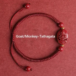 Goat Monkey zodiac Tathagata Buddha cinnabar red string bracelet flat lay gold accents