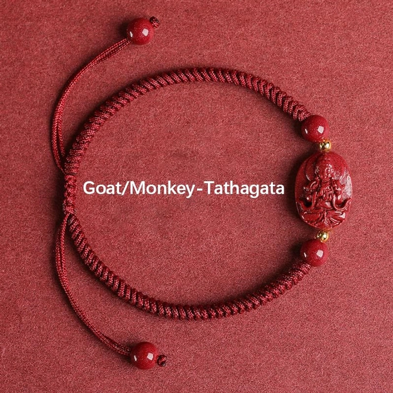 Goat Monkey zodiac Tathagata Buddha cinnabar red string bracelet flat lay gold accents