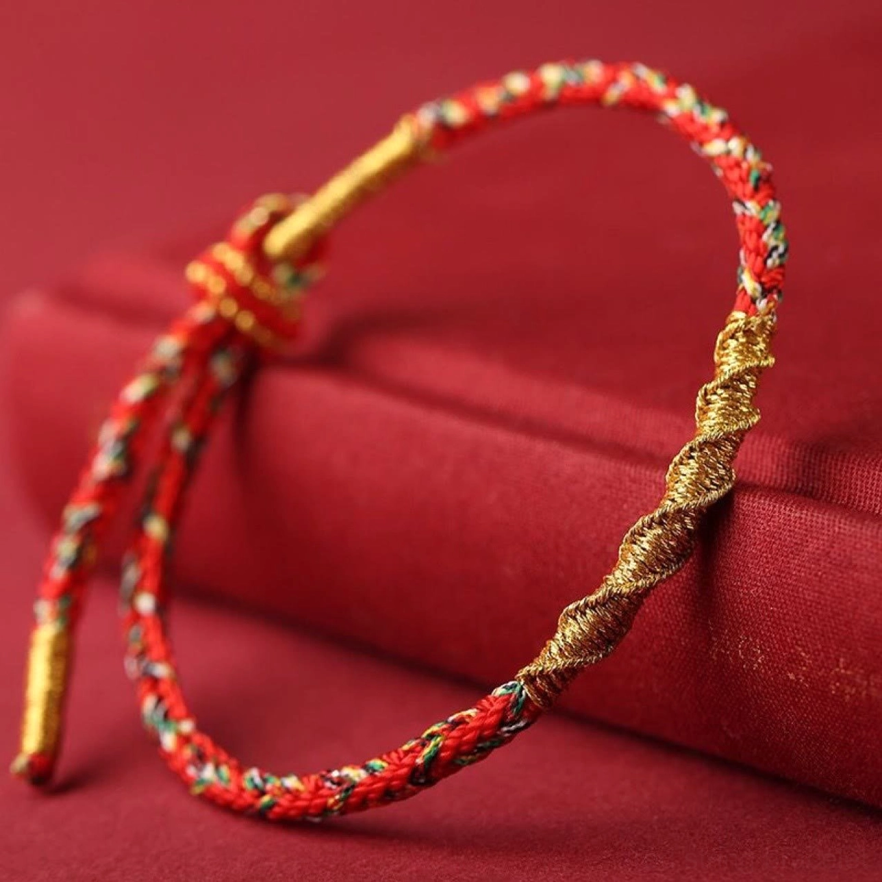 Red and gold braided zodiac natal buddha string bracelet with adjustable drawstring