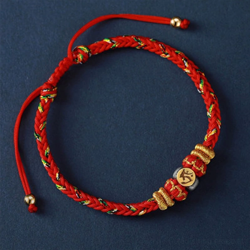Single red zodiac natal buddha bracelet with full circle view showing solid red woven cord and gold woven accents with metal mantra bead