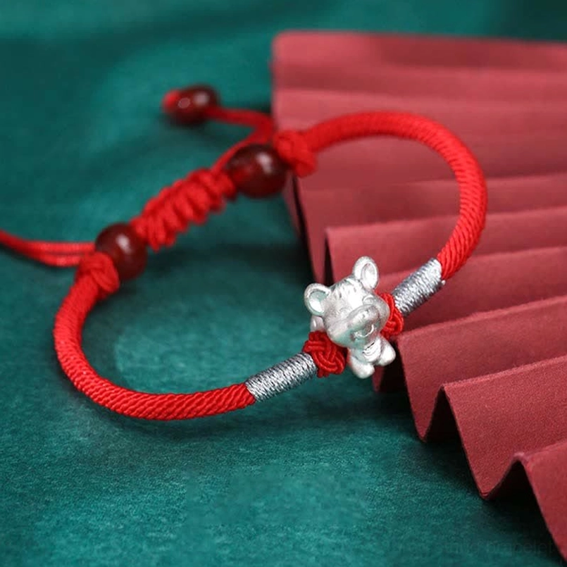 Zodiac ox silver charm red string bracelet with braided silver section and agate beads, full display