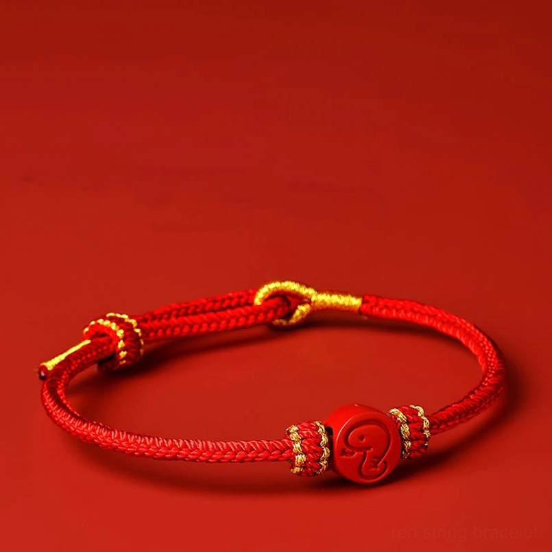 Full view snake zodiac red string bracelet with braided rope and central cinnabar charm